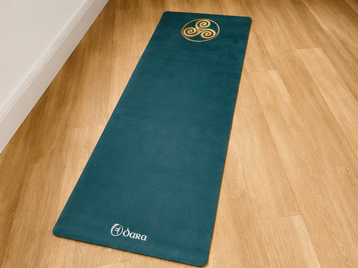 The Triskele yoga mat laid out for practice, Celtic spiral artwork by Dara Mats