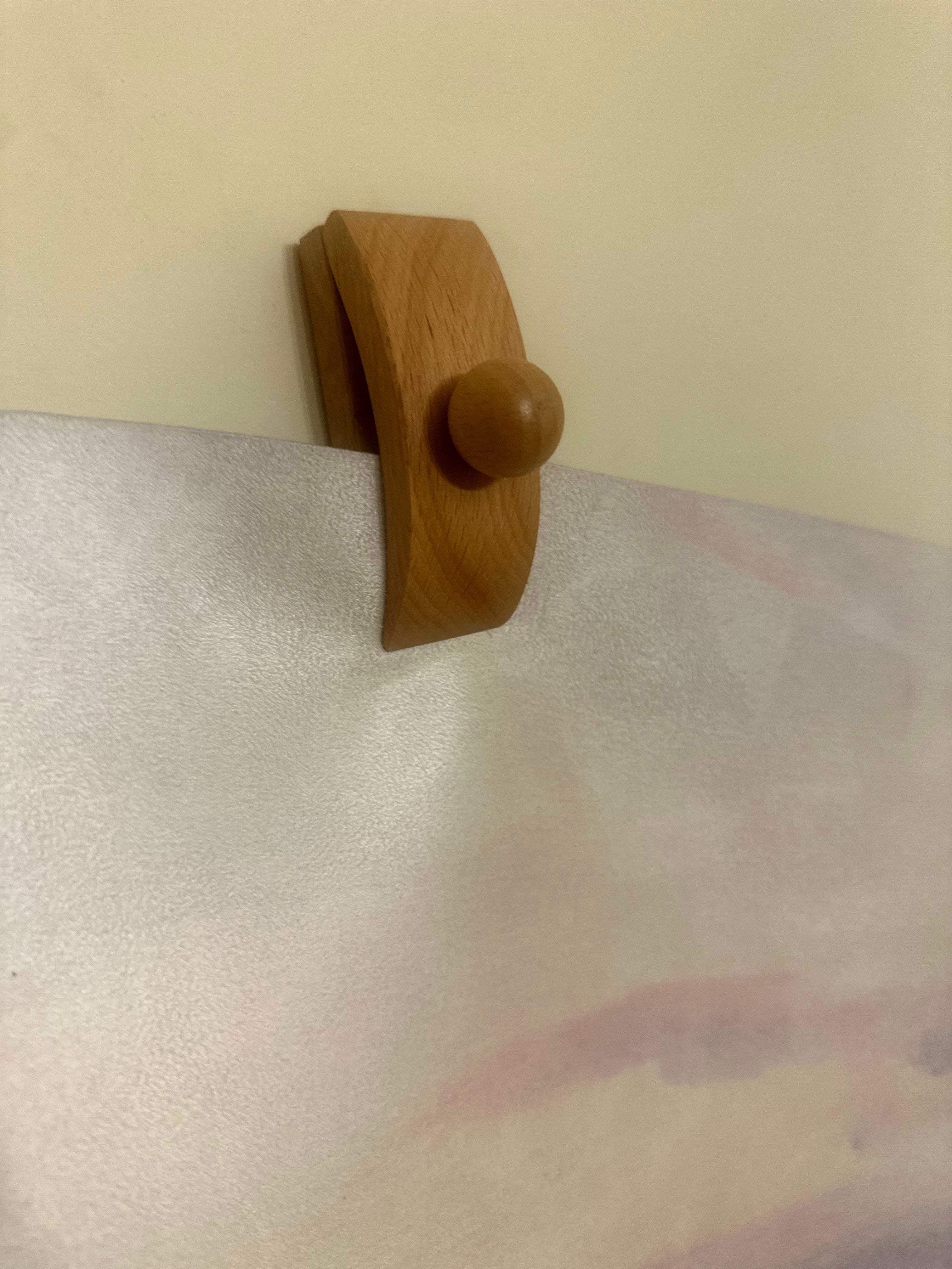 Wooden tapestry holders for hanging a Dara Mats yoga mat