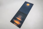Moonlight yoga mat laid out in a home practice space