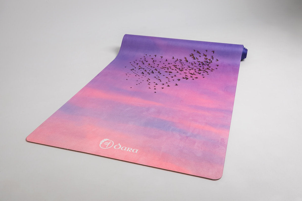 Wonder in the Sky yoga mat by Dara Mats, starling murmuration artwork in an evening sky palette